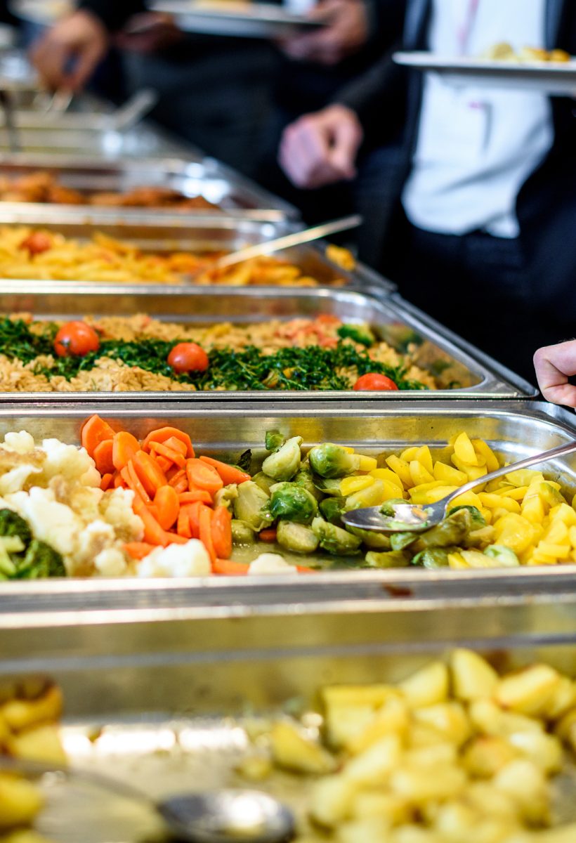 Cuisine Culinary Buffet Dinner Catering Dining Food Celebration Party Concept. Group of people in all you can eat catering buffet food indoor in luxury restaurant with meat and vegetables.